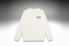 White sweater with text 'Expensive & Difficult' on a light gray background