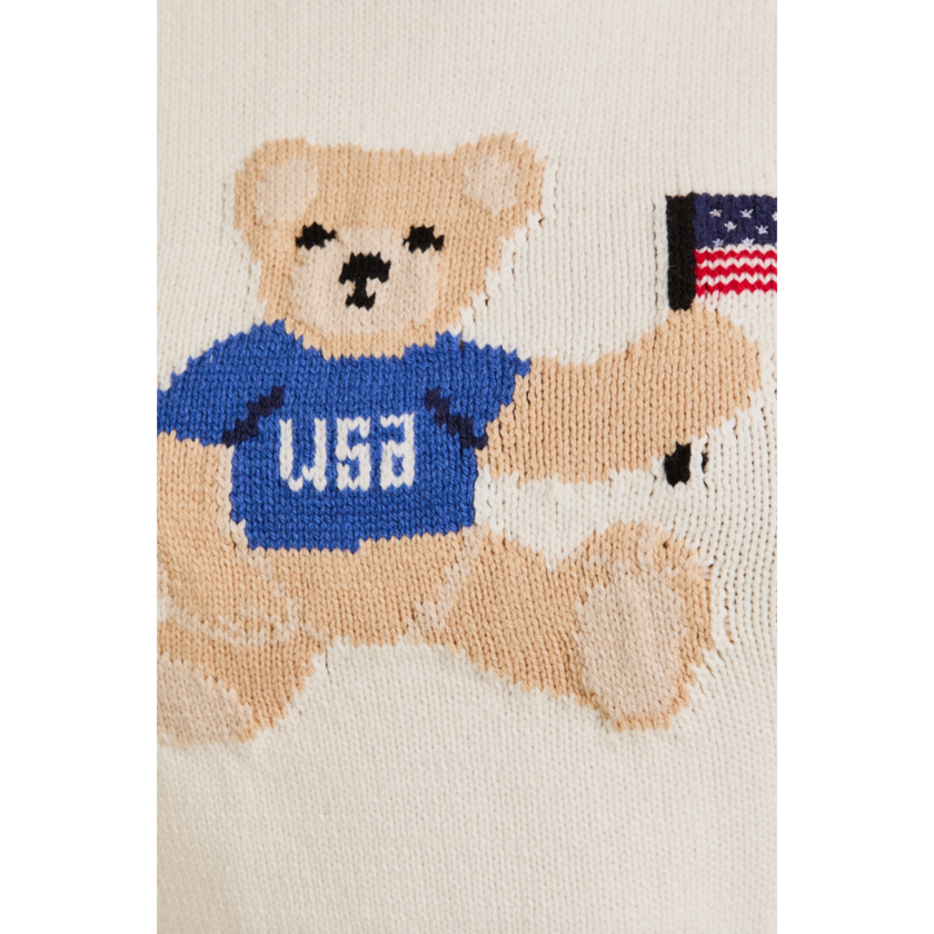 Woman wearing a white USA teddy bear crop top and denim mini skirt – perfect patriotic summer outfit