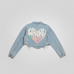 Woman wearing Worry Less cropped denim jacket back view