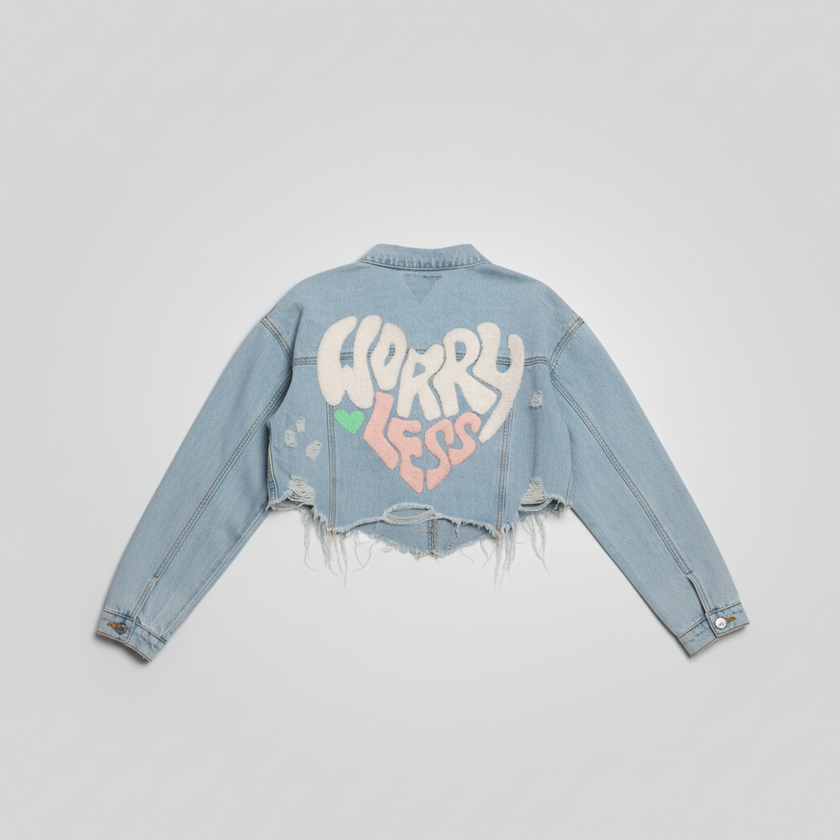 Woman wearing Worry Less cropped denim jacket back view