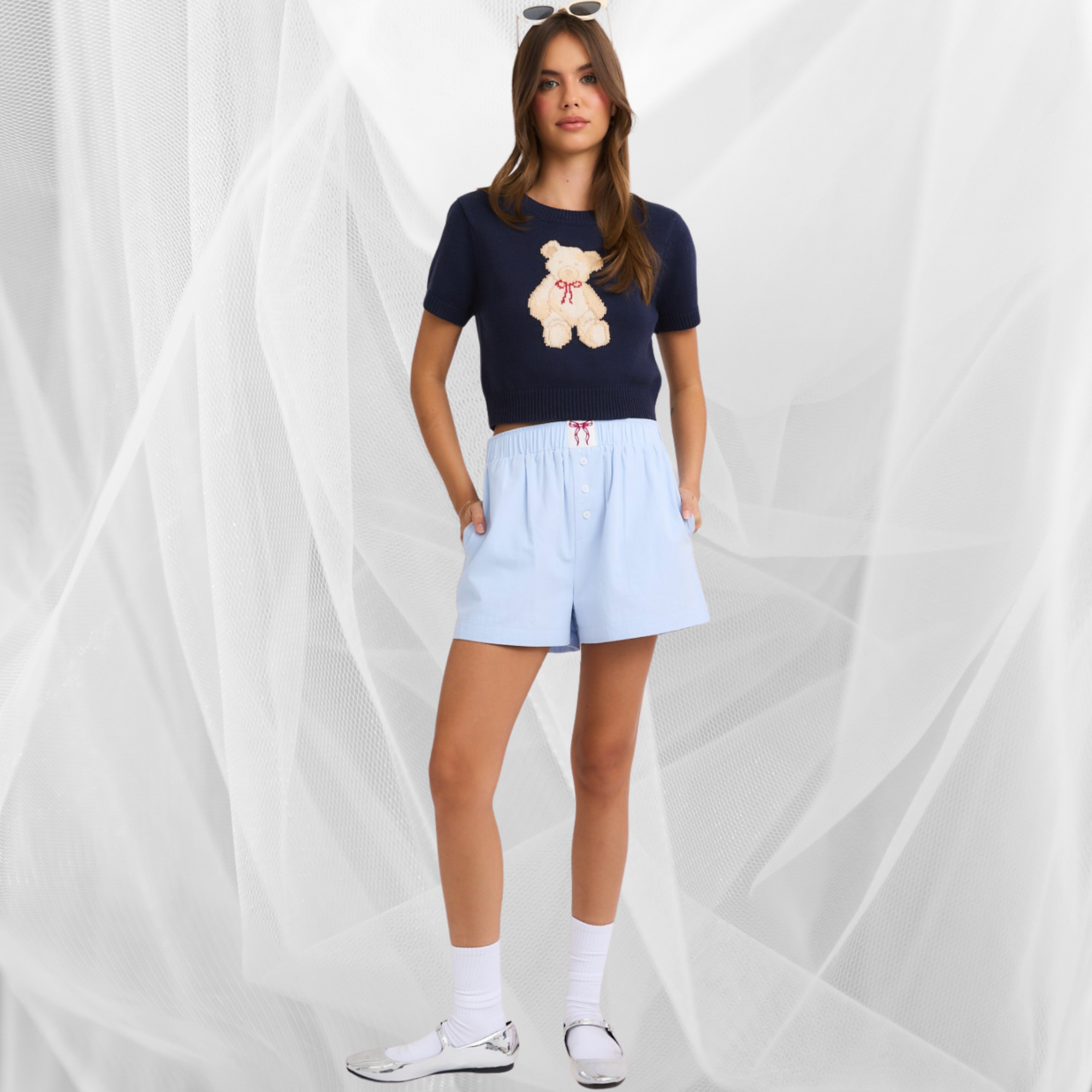 model wearing high waisted boxy cotton shorts