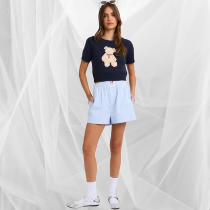 model wearing high waisted boxy cotton shorts